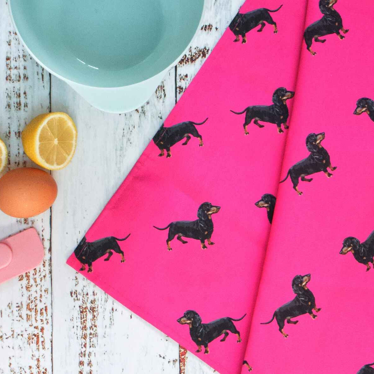 pink teatowel with dachsund sausage dog pattern