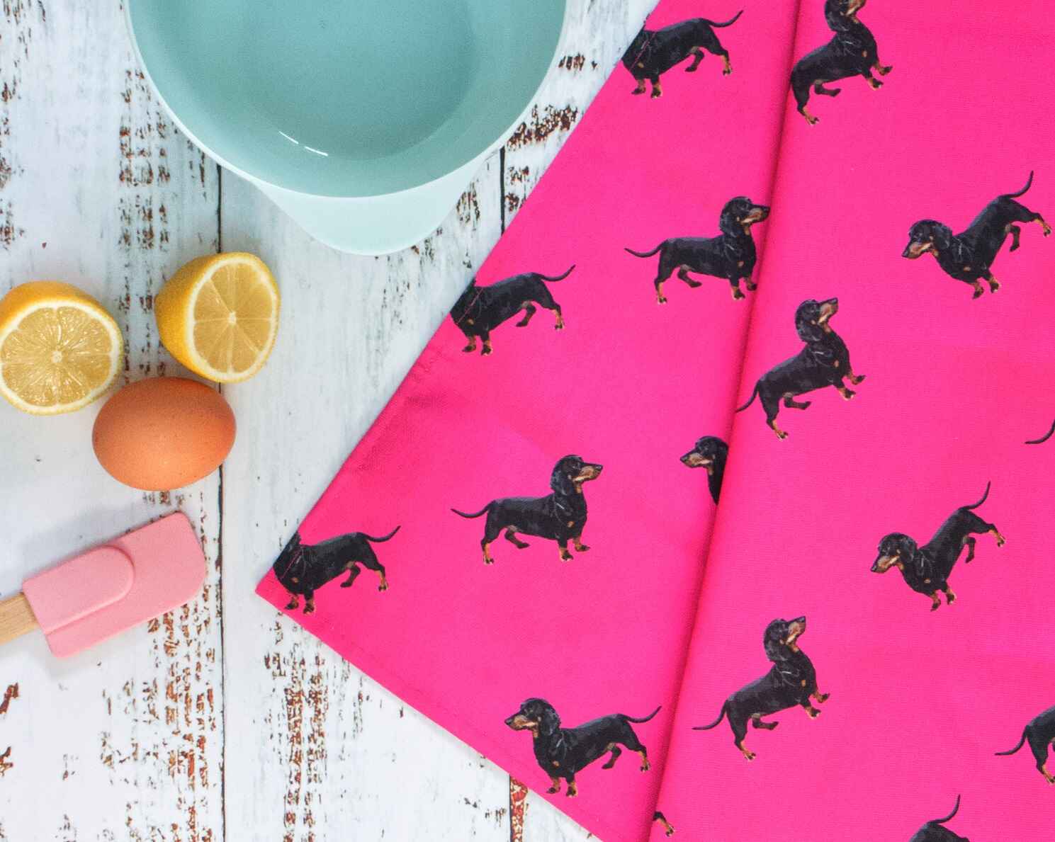 pink teatowel with dachsund sausage dog pattern