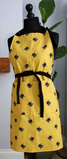 yellow apron with bee pattern